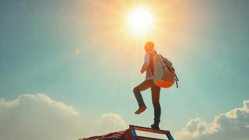 Estudiante asciende hacia sus sueños iluminados